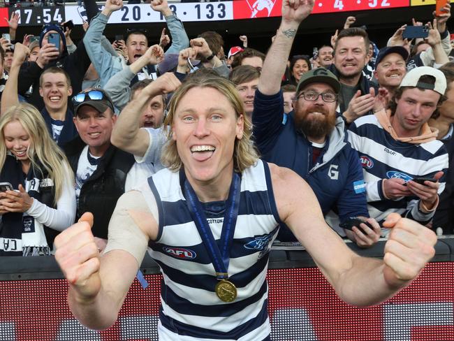 Mark Blicavs with his premiership medallion after the Cats’ win over the Swans. Picture: Mark Wilson