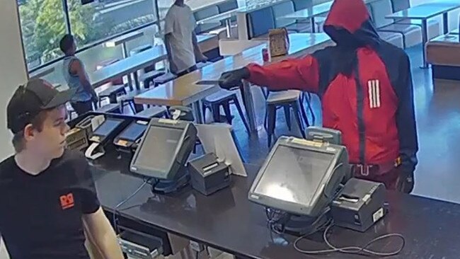 A young thief armed with a knife was caught on CCTV during an armed robbery at the Red Rooster in Aitkenvale on July 29.