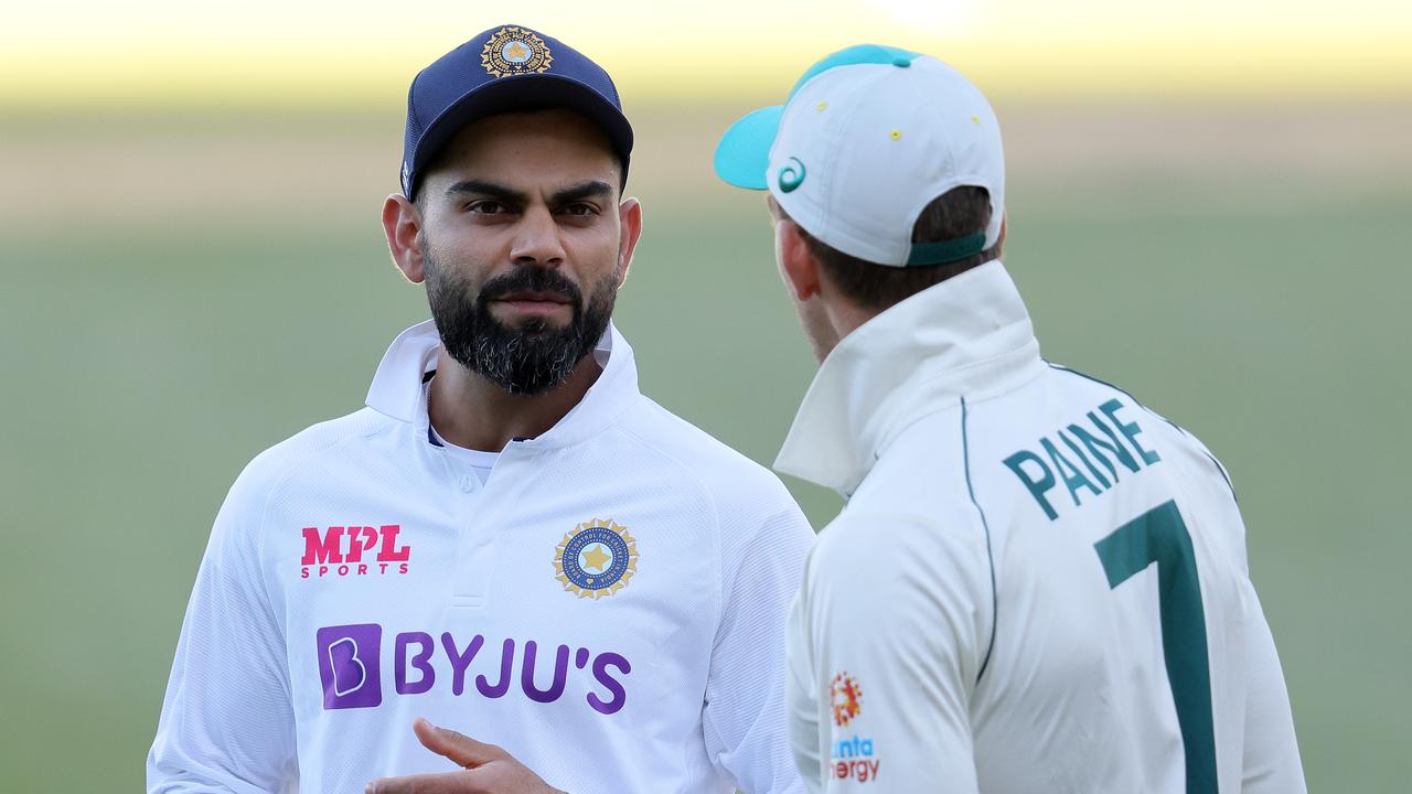 Virat Kohli talks to Tim Paine after the First Test. (Photo by Daniel Kalisz/Getty Images)