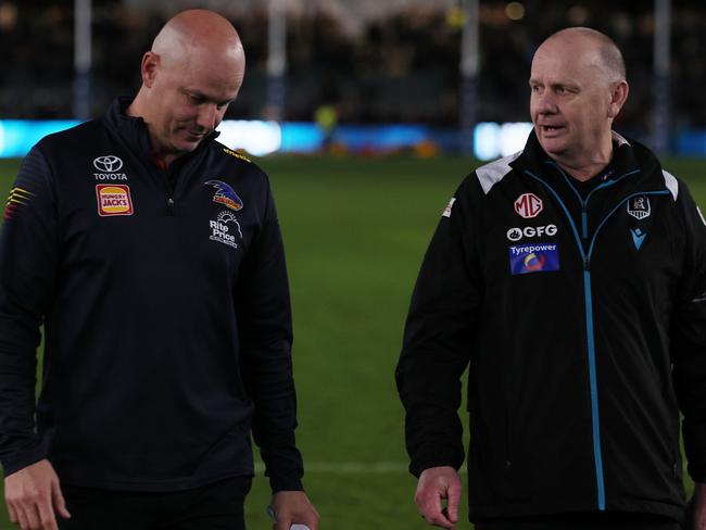 ADELAIDE, AUSTRALIA - AUG 17: Matthew Nicks, Senior Coach of the Crows talks to Ken Hinkley, Senior Coach of the Power during the 2024 AFL Round 23 match between the port Adelaide Power and the Adelaide Crows at Adelaide Oval on August 17, 2024 in Adelaide, Australia. (Photo by James Elsby/AFL Photos via Getty Images)