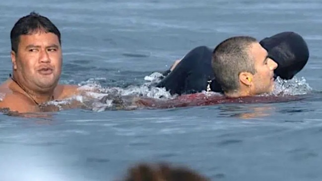 The moment Aussie surf photographer, Byron Mcloughlin, was pulled from the water by Ryan Craig and local bodyboarder Angelo Fararie. Picture: @timmckenna