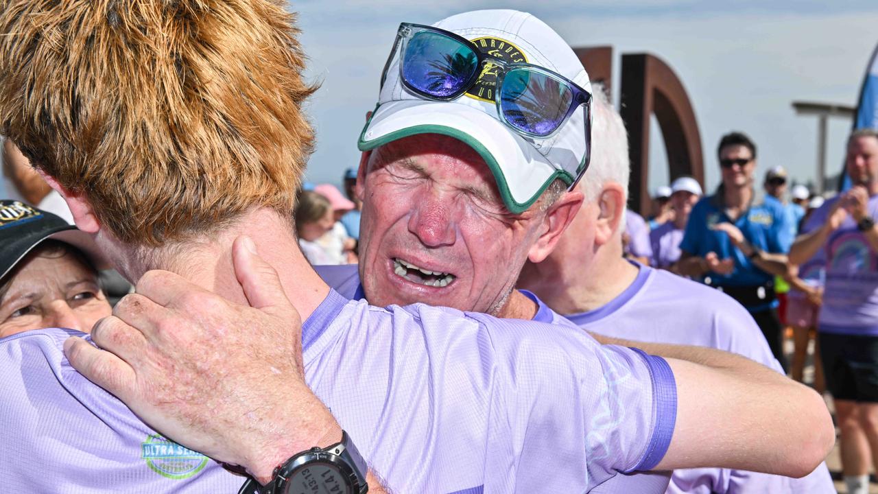 An emotional Asa Cowell, hugs his son Riley. Picture: Brenton Edwards