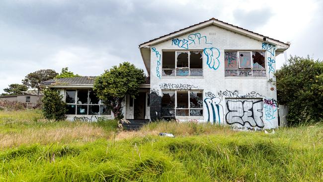 This former four bedroom, two bathroom family home has been left to rot. Picture: Mark Dadswell