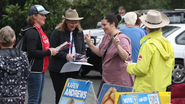 Prepoll voting at Reedy Creek Baptist church. Voters run the gauntlet past volunteers with how to vote cards at Reedy Creek Baptist Church. Picture Glenn Hampson