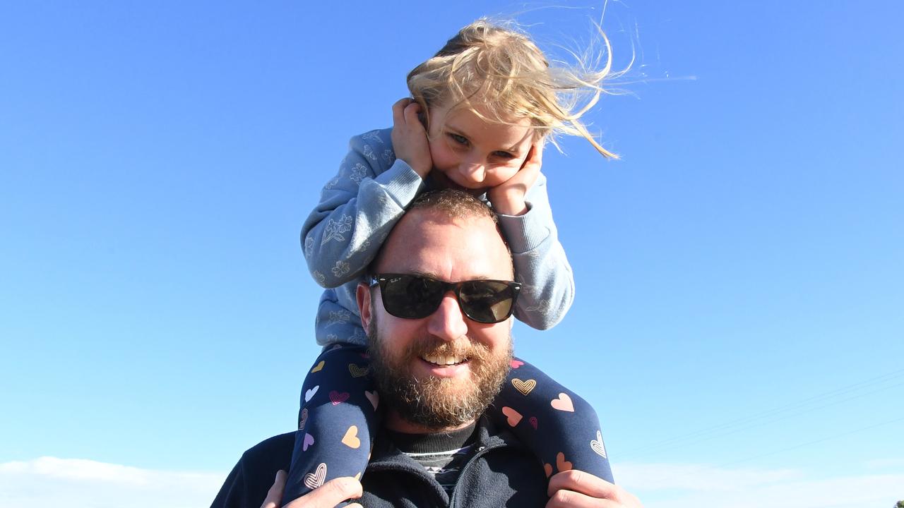 LR: Dad Dave with daughter Lola outside Finke Desert Race HQ on Friday night. Picture: (A)manda Parkinson