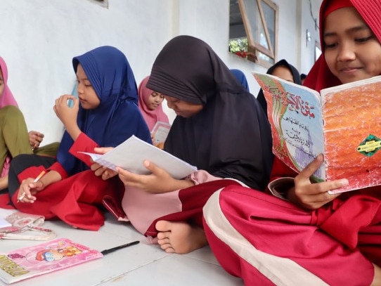 Children of Kekait Daye village in West Lombok learning to read the Koran. Picture: Lukman S. Bintoro