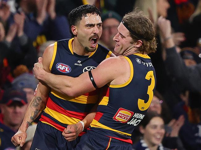 Rankine celebrates a goal with Sam Berry. Picture: Sarah Reed/AFL Photos via Getty Images