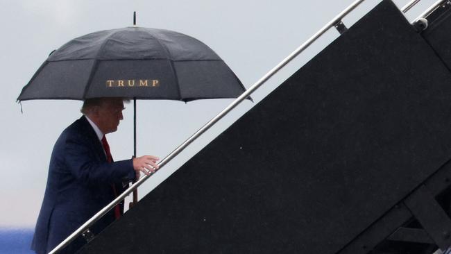 Prosecuting Trump for floating madcap ideas is legally dubious and politically reckless. He is pictured boarding his plane at Reagan National Airport following an arraignment in Washington, DC. Picture: AFP