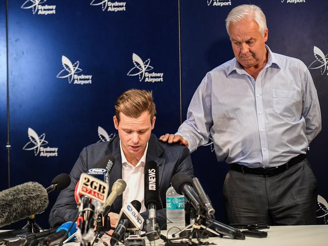 Steve Smith (left) is supported by his father Peter during a press conference after he was stood down as Australian Captain and suspended for twelve months following his involvement in the ball tampering incident in South Africa. Picture: AAP Image/Brendan Esposito