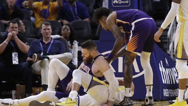 Aron Baynes tries to get up after falling on Stephen Curry.