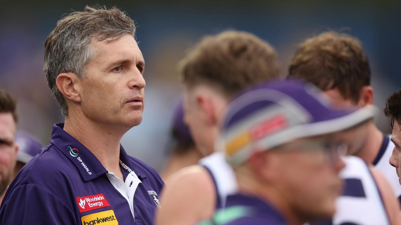 PERTH, AUSTRALIA - FEBRUARY 24: Justin Longmuir, Senior Coach of the Dockers addresses the team at the quarter time break during an AFL practice match between West Coast Eagles and Fremantle Dockers at Mineral Resources Park on February 24, 2024 in Perth, Australia. (Photo by Will Russell/Getty Images)