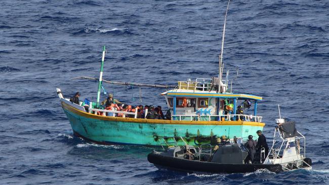 Australian Border Force officers stop a people-smuggling boat with 29 asylum-seekers last month.