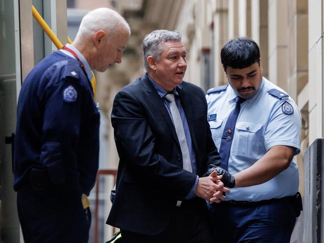 Greg Lynn is led into the Supreme Court. Picture: David Geraghty