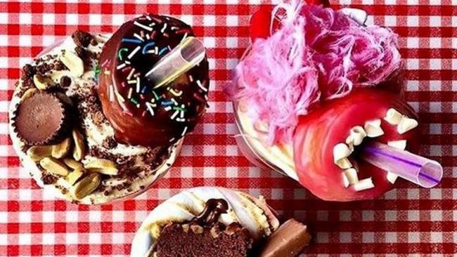 Shakes with iced doughnuts and fairyfloss from Doughnut Time in Brisbane. Instagram/@khierah_salam