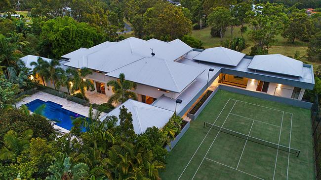 A championship-sized floodlit tennis court is among the amazing features at 11 Jarema Drive, Mudgeeraba.