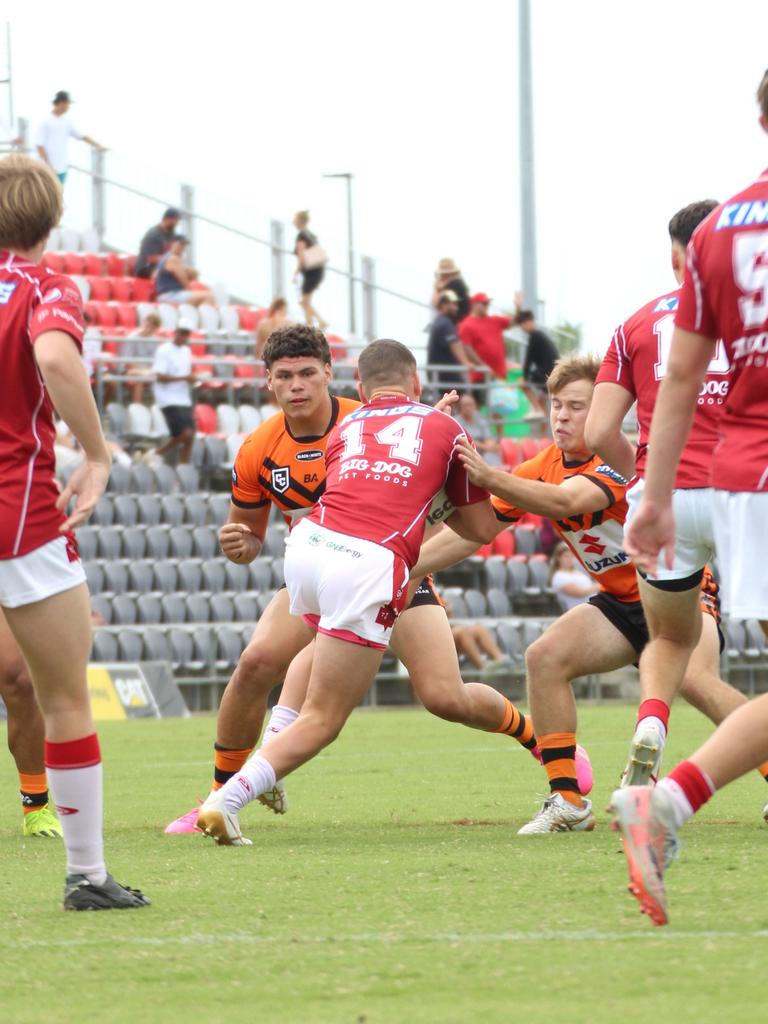 Kobi Floro (left) making a tackle.