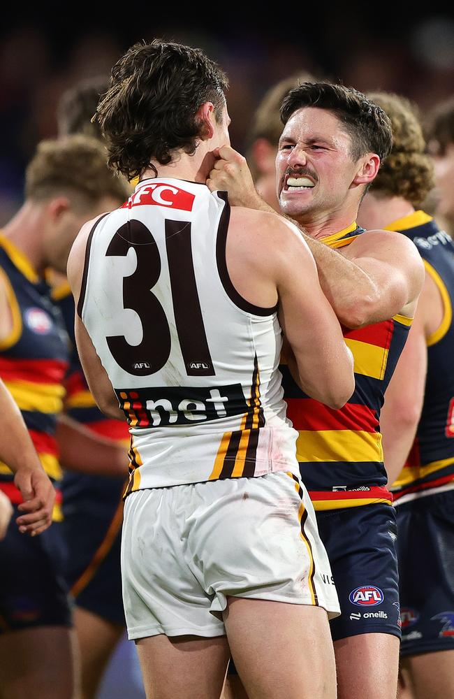 Tempers flare between Chayce Jones and Connor Macdonald, with emotions spilling over late in the game. Picture: Sarah Reed/AFL Photos via Getty Images.