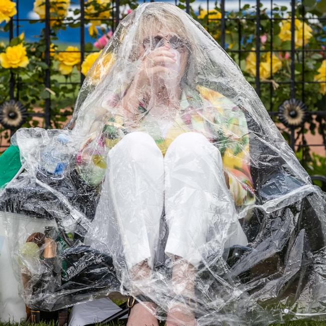 Melbourne’s dismal weather held off long enough to hold the Melbourne Cup before the rain pelted down Picture: Jake Nowakowski