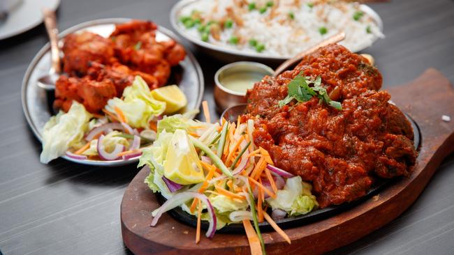 Lamb shanks and chicken tikka at the Khana Khazana restaurant. Picture: Matt Turner.