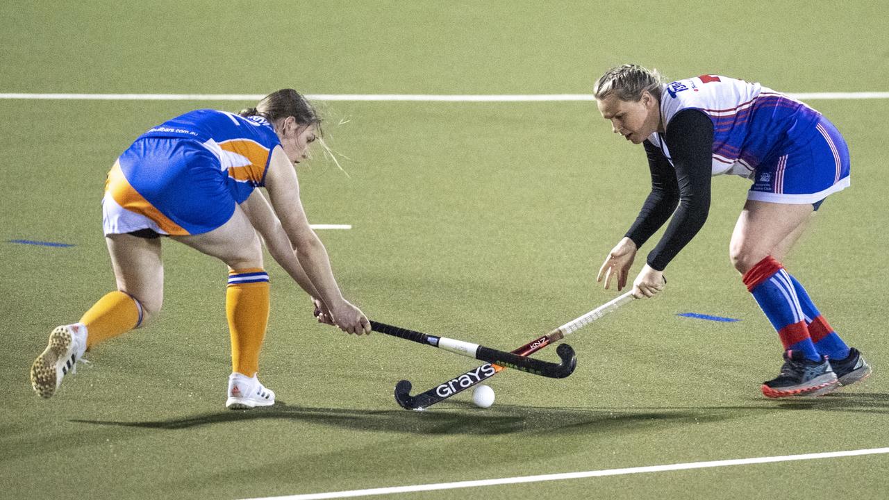 Courtney Wardill for Newtown and Alex Thompson for Rangeville. A1 Women , Toowoomba Hockey grand final. Newtown vs Rangeville. Saturday, September 10, 2022. Picture: Nev Madsen.