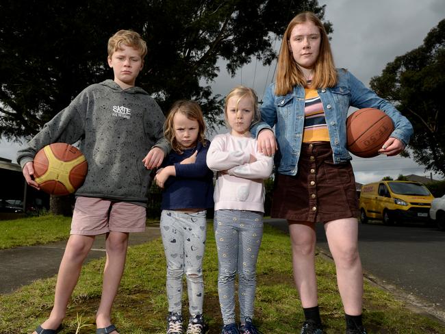 MELBOURNE, AUSTRALIA - NewsWire Photos JULY 14: Ryan Zerbe (12), Adele Salter (5), Beatrice Salter (7) and Corinne Zerbe (14) on the nature strip outside their Halifax Ave Heidelberg homes where thieves have stolen a basketball ring. Picture: NCA NewsWire / Andrew Henshaw