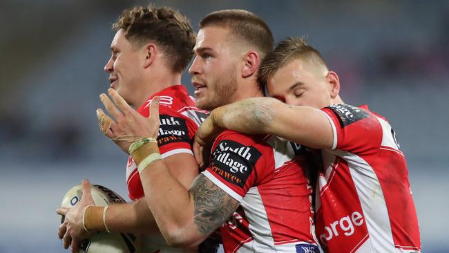 St George's Kurt Mann, Euan Aitken and Matt Dufty celebrate a close victory after the Bulldogs v St George NRL match at ANZ Stadium, Homebush. Picture: Brett Costello