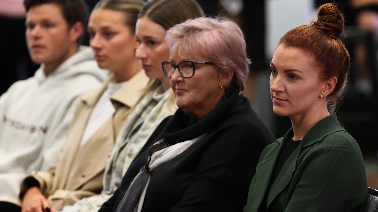 Damien Hardwick’s three children, his mother Pat and girlfriend Alexandra Crow at the press conference when he quit as Richmond coach. Photo: Michael Klein