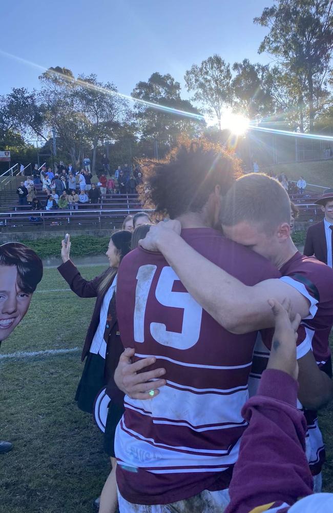 St Peters Lutheran College First XV players from last year embracing each other in their final game representing their school.