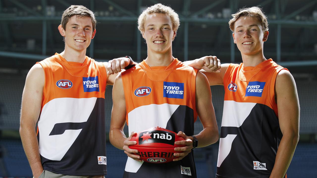 Ryan Angwin (middle) with Conor Stone (left) and Tanner Bruhn, after the Giants selected all three of them in the first round of the 2020 AFL draft. Picture: Getty Images