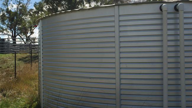 Large Australian tank catches rain water for household use. Device used for conserving water under drought conditions.