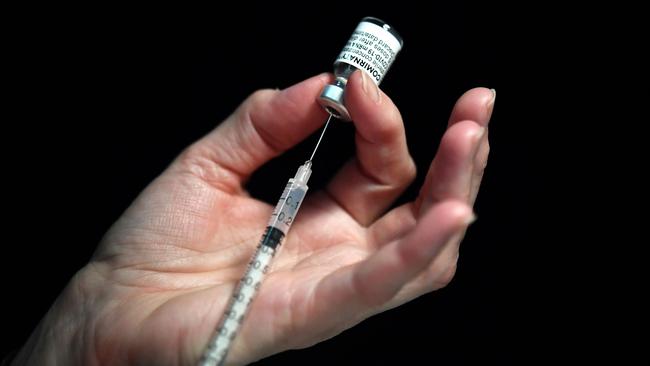Queenslanders are urged to continue getting vaccinated despite the mandate being dropped. Picture: Fred Tanneau / AFP
