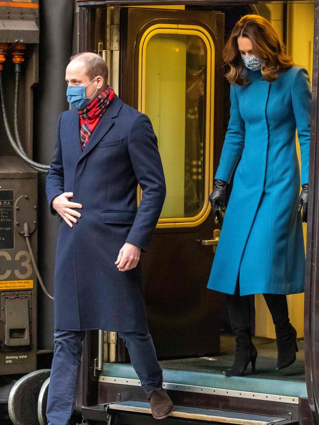 Prince William and Catherine, Duchess of Cambridge disembark the Royal train as they arrive at Edinburgh Waverley station. Picture: AFP