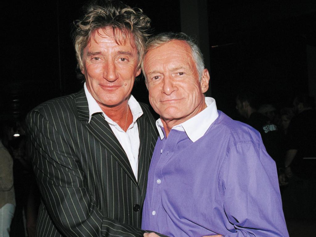 <p>Rod Stewart poses with Playboy founder Hugh Hefner at The Pharmacy on October 9, 2002 in Hollywood, California. Picture: Getty</p>