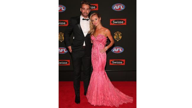 Tall man in a tux. What more could we ask? Andrew Walker of the Blues with partner Kylie Battye. Photo: Getty