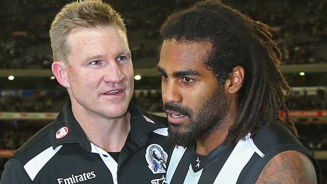 Nathan Buckley and Heritier Lumumba after a Collingwood win in 2013. (Photo by Quinn Rooney/Getty Images)