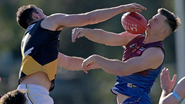 NFNL: Heidelberg’s Sam Gilmore and Jack Langford of Banyule battle in the ruck. Picture: Andy Brownbill