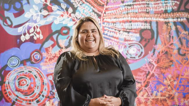 Sally Scales pictured with her artwork about her homeland Ã&#146;AralyaÃ&#147; in the APY studio Adelaide. Pic Roy VanDerVegt.