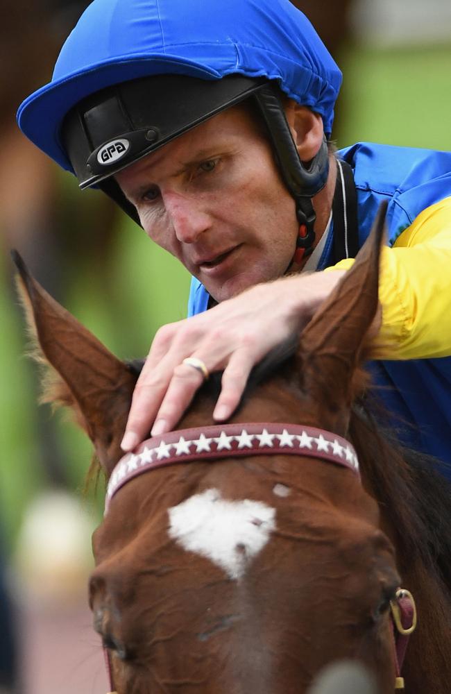 Brad Rawiller gives Black Heart Bart a pat after winning the Victoria Handicap at Caulfield in March. Picture: Getty Images