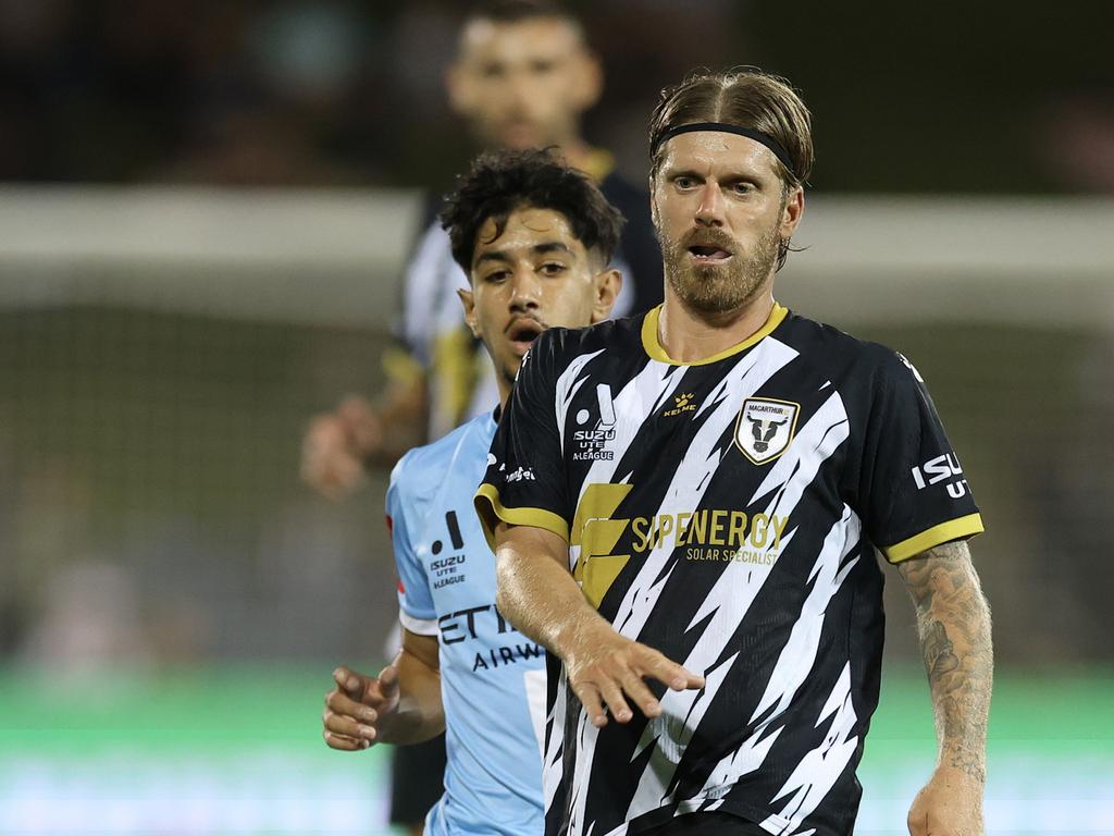 Mikey Ghossaini of Melbourne City and Luke Brattan of the Bulls compete for the ball. Photo: Mark Evans/Getty Images.