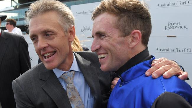 Jockey Joshua Parr (black cap) is seen with trainer Mark Newnham after riding Shadow Hero to victory in race 7, the Mostyn Copper Randwick Guineas during Randwick Guineas Day at Royal Randwick Racecourse in Sydney, Saturday, March 7, 2020. (AAP Image/Simon Bullard) NO ARCHIVING, EDITORIAL USE ONLY