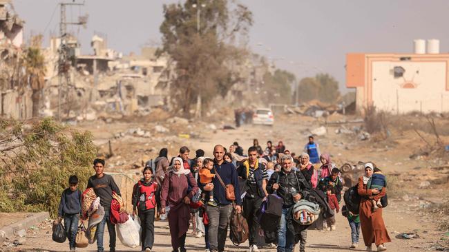 Palestinians fleeing the north walk along the Salaheddine road in the Zeitoun district on the southern outskirts of Gaza City on November 26, 2023. Picture: Mahmud Hams/AFP