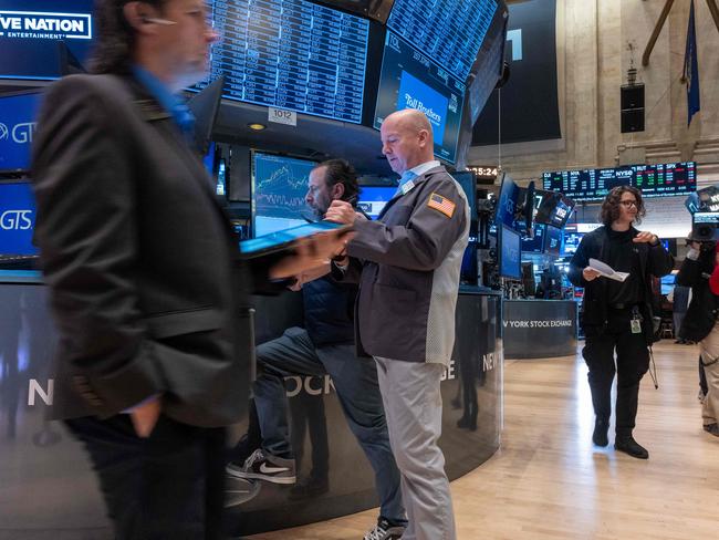 NEW YORK, NEW YORK - NOVEMBER 12: Traders work on the New York Stock Exchange (NYSE) floor on November 12, 2024 in New York City. After closing at record highs yesterday, the Dow was down slightly in morning trading.   Spencer Platt/Getty Images/AFP (Photo by SPENCER PLATT / GETTY IMAGES NORTH AMERICA / Getty Images via AFP)