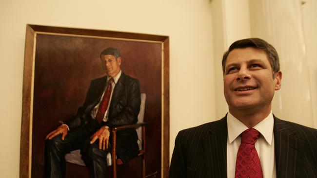 Steve Bracks with his portrait, painted by artist Garry Anderson, that hangs in the Queens gallery at Parliament House.