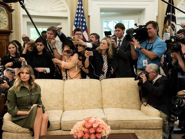 What could she possible be thinking … Melania Trump with her back to the media pack as she listens while US President Donald Trump speaks to the press before a meeting with Argentina's President Mauricio Macri in the Oval Office of the White House. Picture: AFP