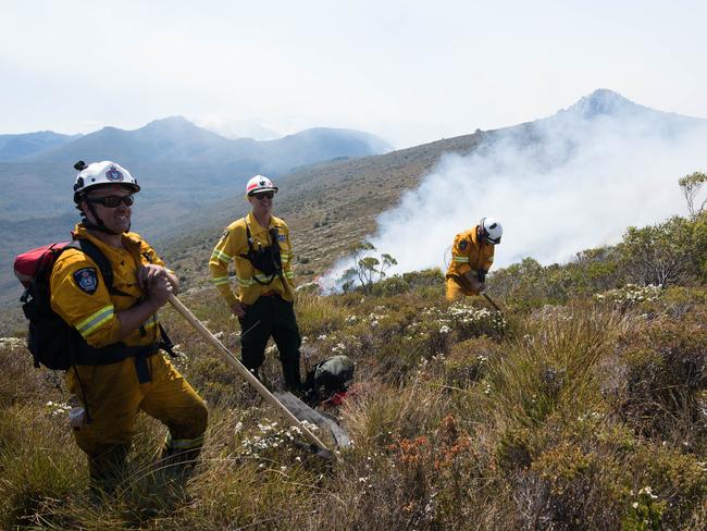 BATTLE: Tasmania Fire Service firefighters at the Gell River fire. Picture: WARREN FREY/TASMANIA FIRE SERVICE