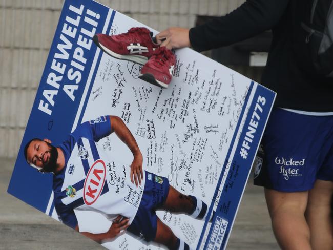 A signed Asipeli Fine poster is carried outside the club. Picture: John Grainger