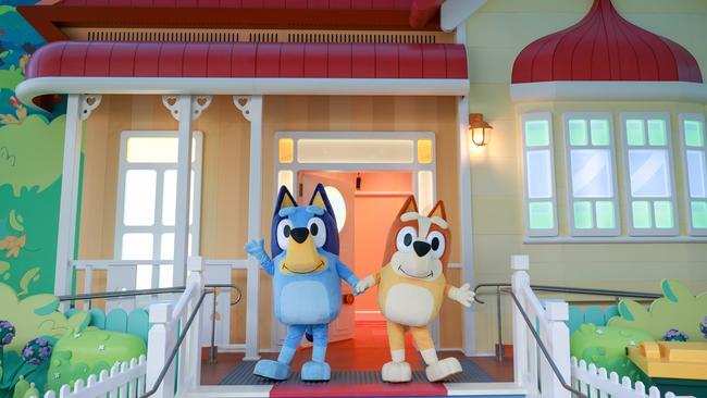 Bluey and Bingo outside their house at Bluey's World in Brisbane.