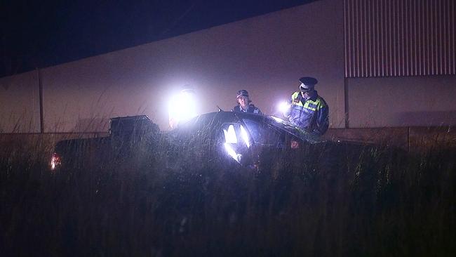 Police at the scene near Emerald Beach where a man was found in a car shot four times on Wednesday, April 7.