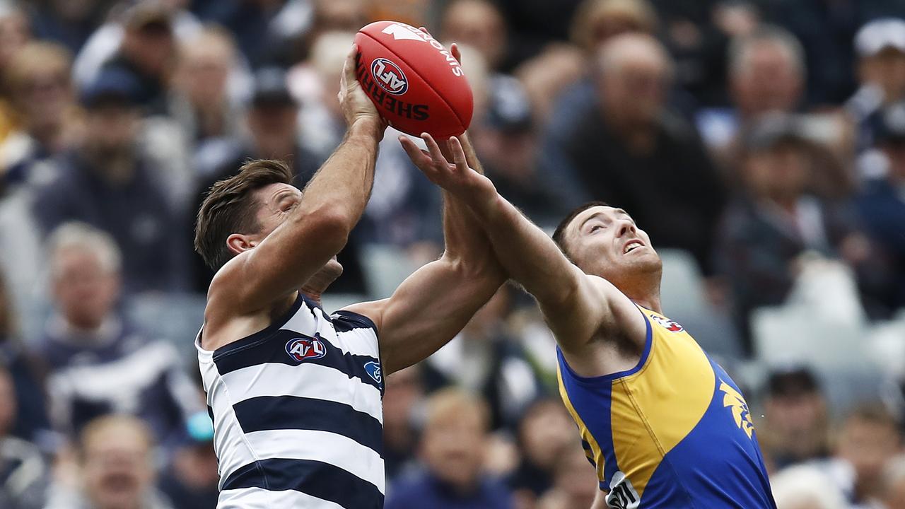 Tom Hawkins outmarks Eagle Jeremy McGovern.