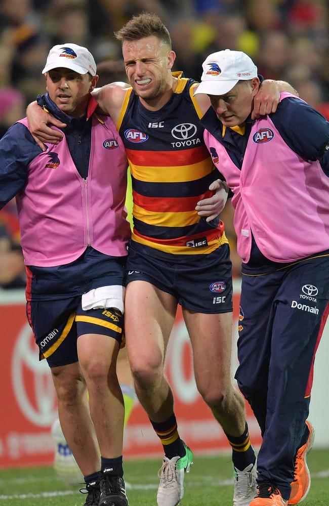 Brodie Smith is carried off injured during the qualifying final against GWS in 2017. Picture: AAP Image/David Mariuz